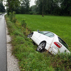 A car has come off the road and is in a field - Fenstersheib Law Group, P.A